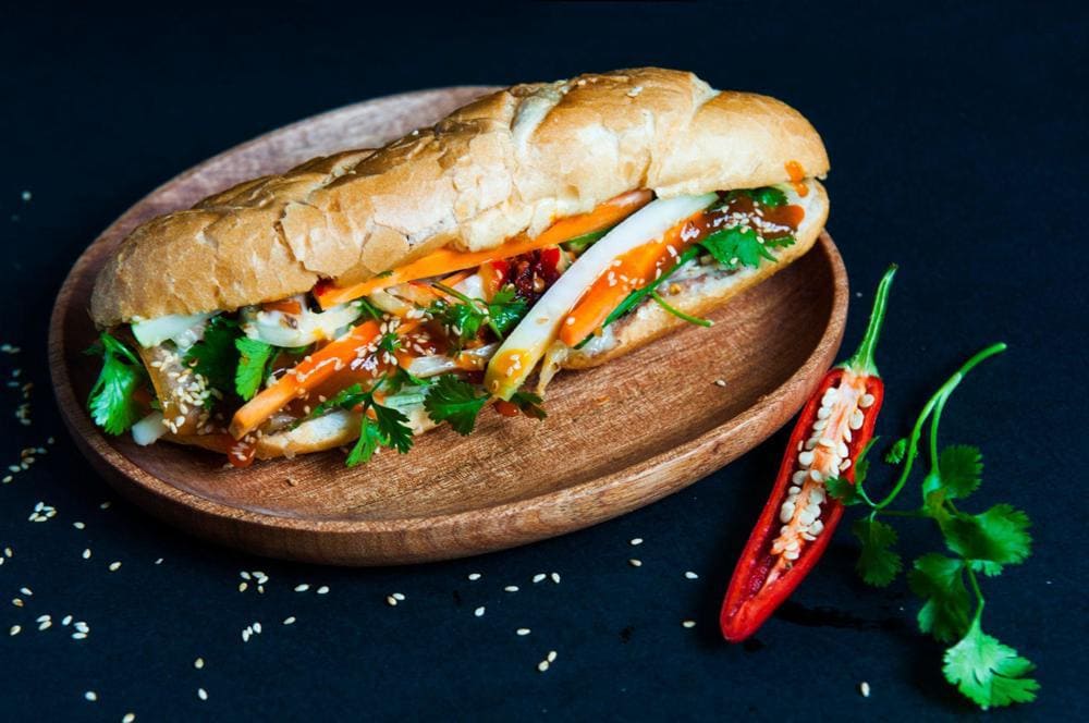 Banh mi, often referred to as the Vietnamese baguette sandwich, is a beloved symbol of street food in Vietnam